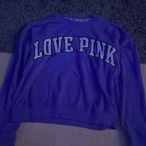 A Purple Victorias Secret Sweat shirt in a size Medium